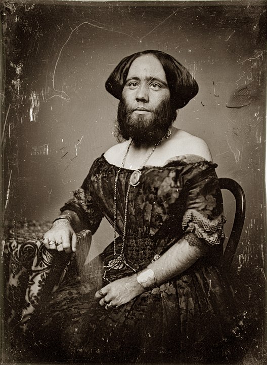 Josephine Clofullia reclining in a chair